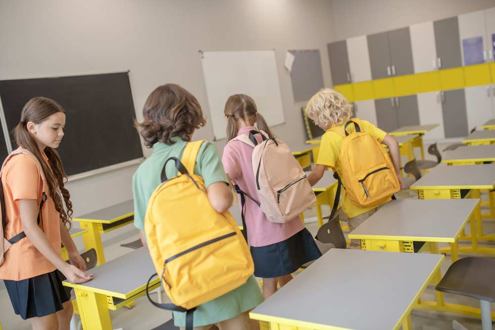 Children entering empty classroom